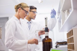 Researchers working with chemicals in lab: CannaClix CBD Oils Blog
